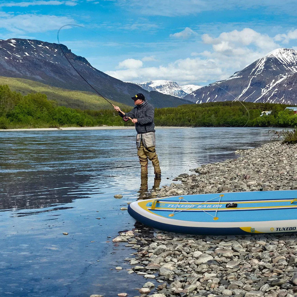 A man using an Inflatable Paddle Board for Fishing