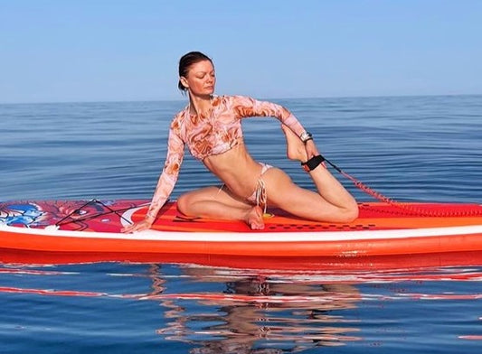 A stable and wide paddleboard designed for yoga and meditation on the water. 